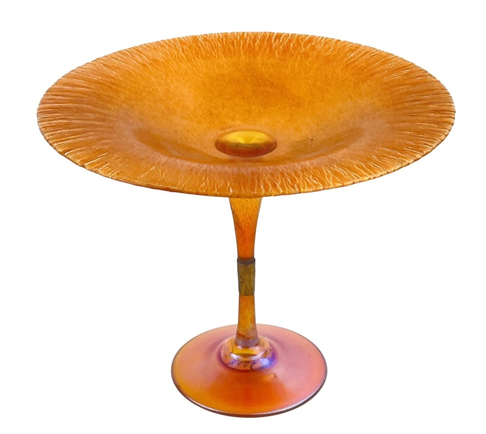 Durand Iridescent Glass Compote: Durand Iridescent Glass Compote Vineland, New Jersey, 1924?1931. Gold iridescent glass compote with a broad dish displaying radiating stretched decoration, raised on a tapered stem and circular foot. 