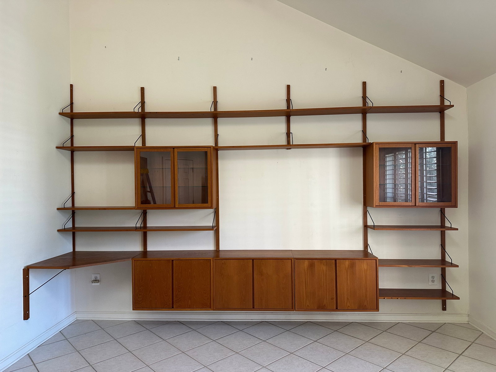 Poul Cadovius, Cado “Royal System” 6-Bay wall unit: Poul Cadovius for Cado “Royal System” Five-Bay Modular Teak Wall Unit, c.1960s. Constructed in teak and teak veneer with black-enameled metal supports, the six-bay configuration comprises vert