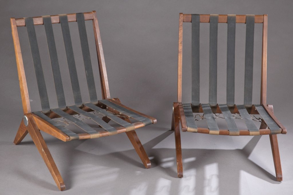 Pair of Pierre Jeanneret for Knoll scissor chairs.: A pair of Pierre Jeanneret for Knoll Scissor Chairs. 3rd quarter 20th century. Wood frames with support straps. 29 1/2"h x 21"w x 26 1/2"d. Provenance: The property of The Honorable Thomas S. Foley, f