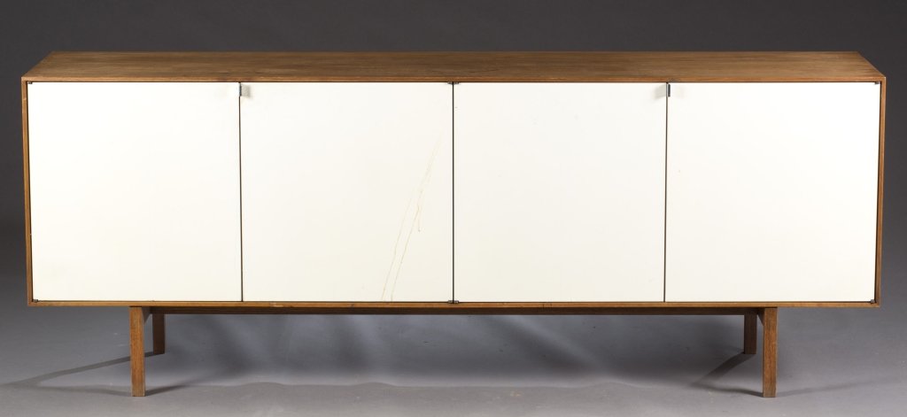 Credenza with white laminate doors.: A teak Mid-Century modern credenza. 2nd half 20th century. With white laminate panel doors. 29"h x 76"w x 18"d. Provenance: The property of The Honorable Thomas S. Foley, former Speaker of the House O
