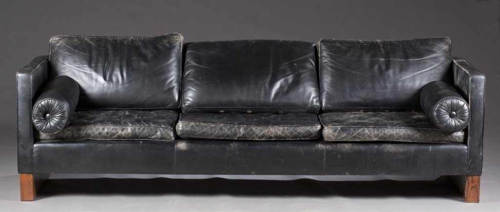 Black leather 3 seat modern sofa.: A Knoll black leather sofa. 2nd half 20th century. Designed by Mies van der Rohe. With notched leather cushions on walnut frame. Knoll tags on leather cushions. Sticker on back, "Property of United St
