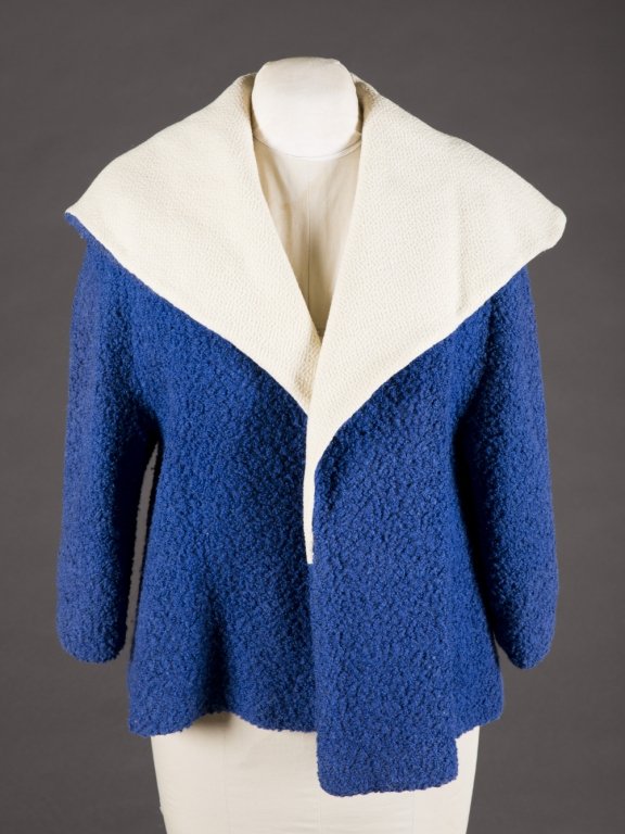Blue Swing coat from Judy Garland's wardrobe.: A blue and white wool swing coat belonging to Judy Garland, monogrammed in crystals, "JG." From her personal wardrobe, accompanied by authenticating documents.