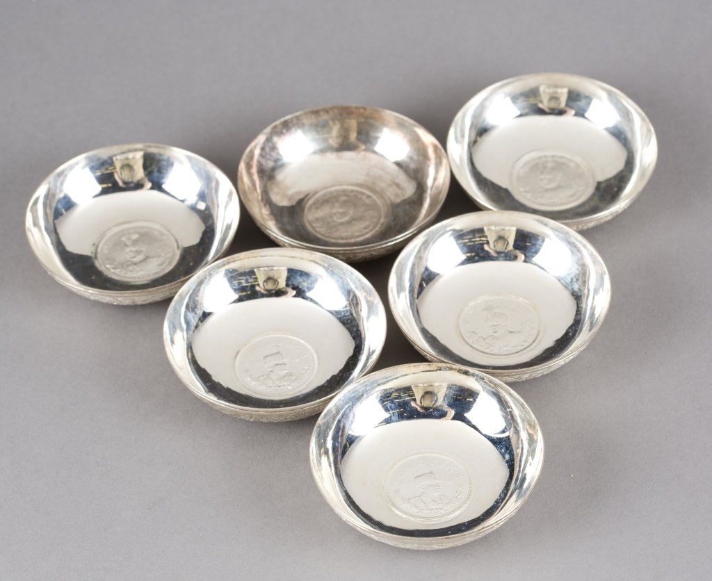 Group of 6 Silver Iranian wine tasting bowls.: Group of six .875 silver Iranian Shah Reza Pahlavi engraved wine tasting bowls. With coin in the center of each bowl. 2 3/4"dia x 3/4"h.
