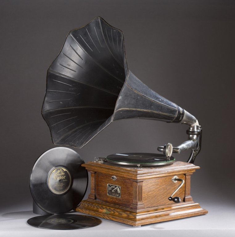 Victor III phonograph with horn and records.: A Victor III model phonograph made by Victor Talking Machine Company. Early 20th century. With a morning glory horn and 6 records. 7"h x 14"w x 14"d. Horn: 24"h x 18"diam.