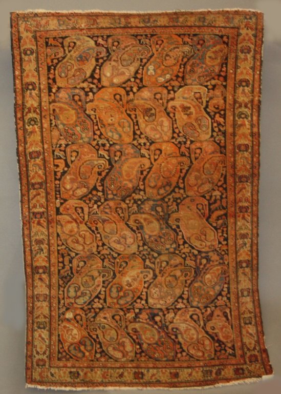 Farahan Sarouk orange and navy carpet.: A Farahan Sarouk carpet. c.1920s-30s. Navy ground with orange paisleys. 100% hand knotted wool. 6'3" x 4'3".