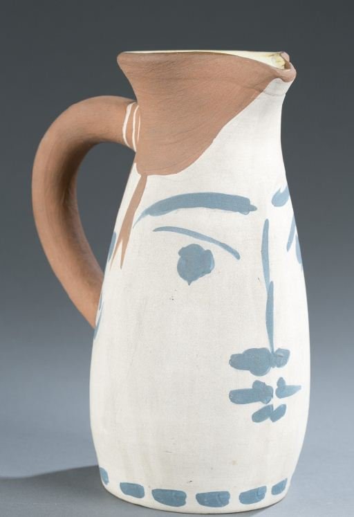 Picasso Madoura pottery painted jug 52/300: Picasso, Pablo (Sp./Fr., 1881-1973). Painted ceramic jug with white and blue face. With Madoura and Edition Picasso stamp on bottom. Also marked 52/300 Edition Picasso Madoura. 8 1/2"h x 4"w x 6"d. Co