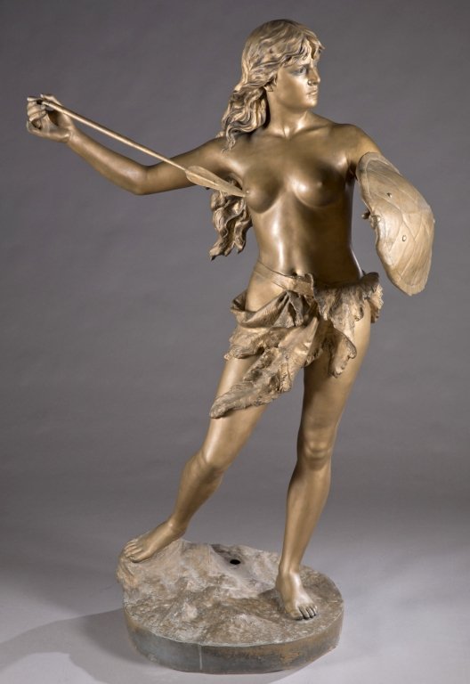 J. Garnier amazon sculpture.: After Jean Garnier (French, 1820-1895). "Amazone Combattant". 19th century. Patinated white metal. Signed J. Garnier. Plaque on base "Amazone Combattant par Garnier". 66"h Condition: Missing back half