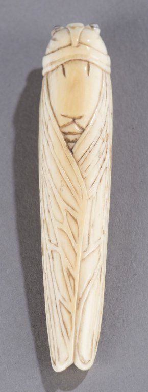 Locust netsuke.: Two locust netsuke. ++ Bone elongated form, with signature on underside of wing. 3 "l. ++ Carved wood locust on section of bamboo. Signature in red on ivory reserve. 2 1/4".