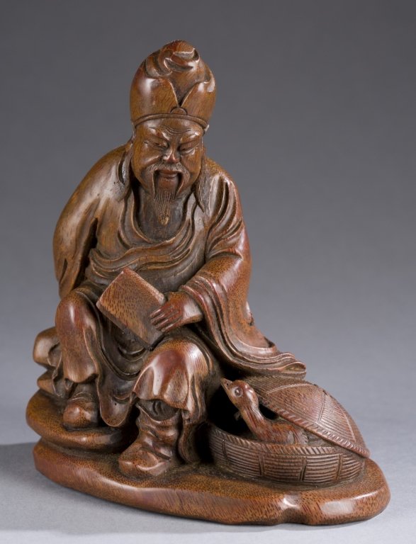 Chinese carved bamboo figure.: A carved bamboo Chinese figure of a man and goose. 19th/20th century. 7 1/2" x 6".