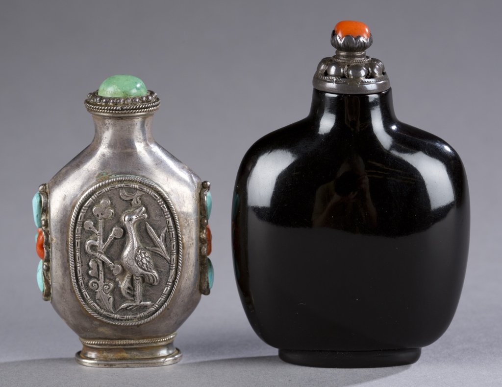 2 wood and silver snuff bottles.: Two Chinese snuff bottles.19th century. ++ Lacquered wood, flattened rectangular form. Glossy finish. Mongolian metal stopper. 2 3/4". ++ Mongolian silver snuff bottle having image of a bird and deer 
