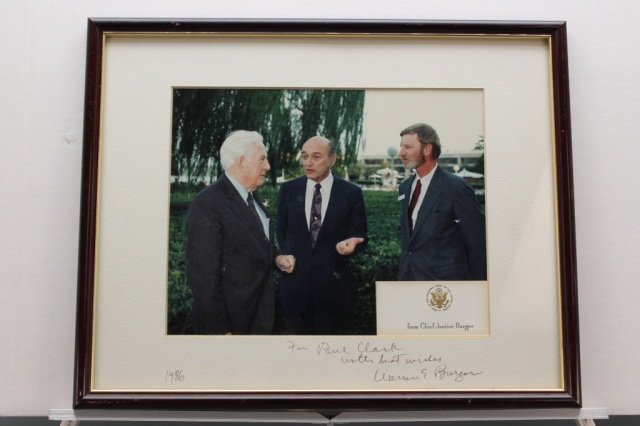 Warren E. Burger. Sibned inscription.: [Supreme Court]. Warren E. Burger. Chief Justice. SIGNED INSCRIPTION on white mat dated 1986. Oblong 8 x 10 color photograph of Chief Justice Burger talking with Paul Clark (recipient of the photo and