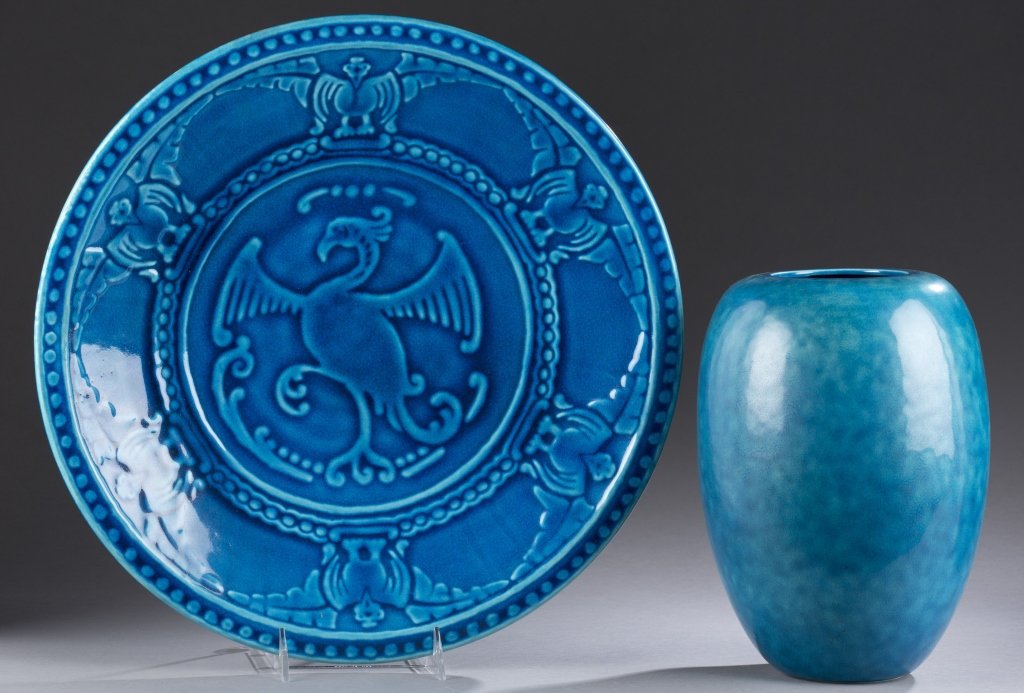 A Cowan Pottery Thunderbird Plaque. Egyptian blue with: A Cowan Pottery Thunderbird Plaque. Egyptian blue with impressed Cowan mark in bottom center. 15 1/2" w. ++Vase V-90 with impressed Cowan mark on bottom in blue. Vase: 9 3/4"h x 3 1/4"w.