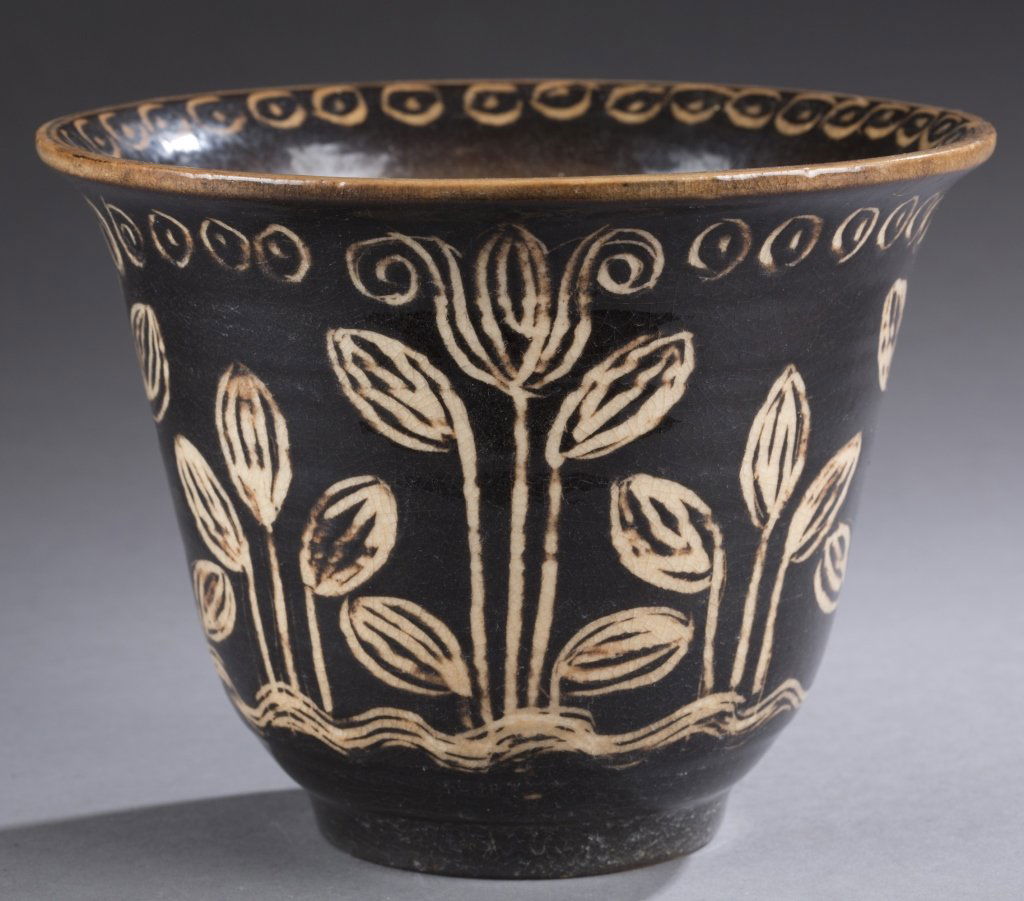 A Cowan Pottery hand painted V-36 vase by Thelma: A Cowan Pottery hand painted V-36 vase by Thelma Frazier with decoration by Whitney Atchley. c. 1930.Clear crackle with hand decoration in dark brown. Vase: 5 1/2"h x 7"w. Condition: Has large crack i