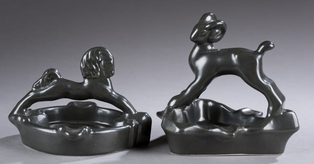 A Cowan Pottery lion and ram ashtray by Edris: A Cowan Pottery lion and ram ashtray by Edris Eckhardt. c. 1930. Black. Both having impressed Cowan mark on bottom. Both: 3 1/4"h x 5 1/4"w.