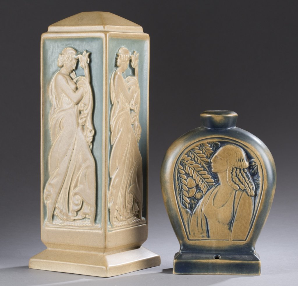 A Cowan Pottery group of two bas relief lamps. Lamp: A Cowan Pottery group of two bas relief lamps. Lamp 908. Parchment blue glaze. 13 1/2"h x 5"w. ++ Lamp 919-B. Parchment. Marked on bottom with glaze and technique. 8 1/4"h x 4 1/2"w.
