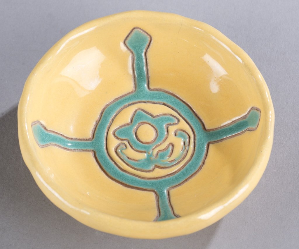 A Cowan Pottery small dish by Edris Eckhardt. Daffodil: A Cowan Pottery small dish by Edris Eckhardt. Daffodil and peackcock. Signed, "Edris, 35," on bottom. 4 1/2".