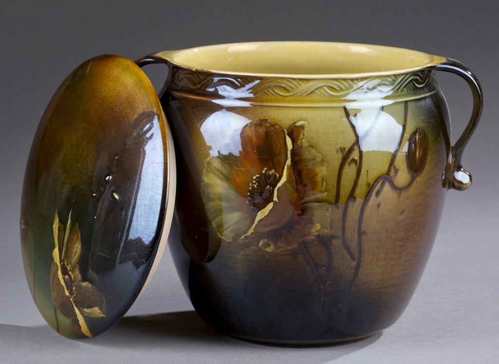 A Rookwood two handled biscuit jar with by William P.: A Rookwood two handled biscuit jar with by William P. McDonald. 1892. Floral mum design on vine and lid. Impressed on bottom, Rookwood mark, 234 and W. 5 1/2".