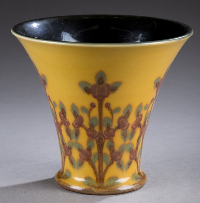 A Rookwood vase by Sara Sax. 1922. Flare rimmed high: A Rookwood vase by Sara Sax. 1922. Flare rimmed high glaze vase with brown and green floral design on yellow backing. Impressed on bottom, Rookwood stamp, 2264 E, XXII and artist mark. 5 1/2".