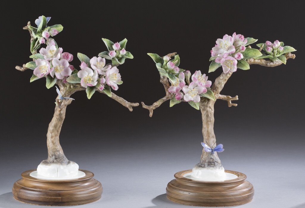 Royal Worcester, Dorothy Doughty Apple Blossom.: A pair of Royal Worcester porcelain Apple Blossom sprays by Dorothy Doughty. 20th century. Having pink blossoms with blue butterflies. 7 1/2"h.