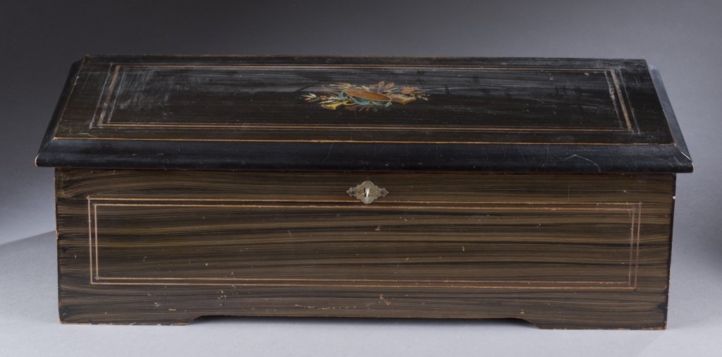 Swiss 10 song painted oak music box.: A Swiss 10 song grain painted oak music box. Late 19th century. Songs included The Washington Post, The Tar and Baskar, Freyschitz, The Honey Green, Annie Lannie, Dorothy, The Star Spangled Banner, Ba