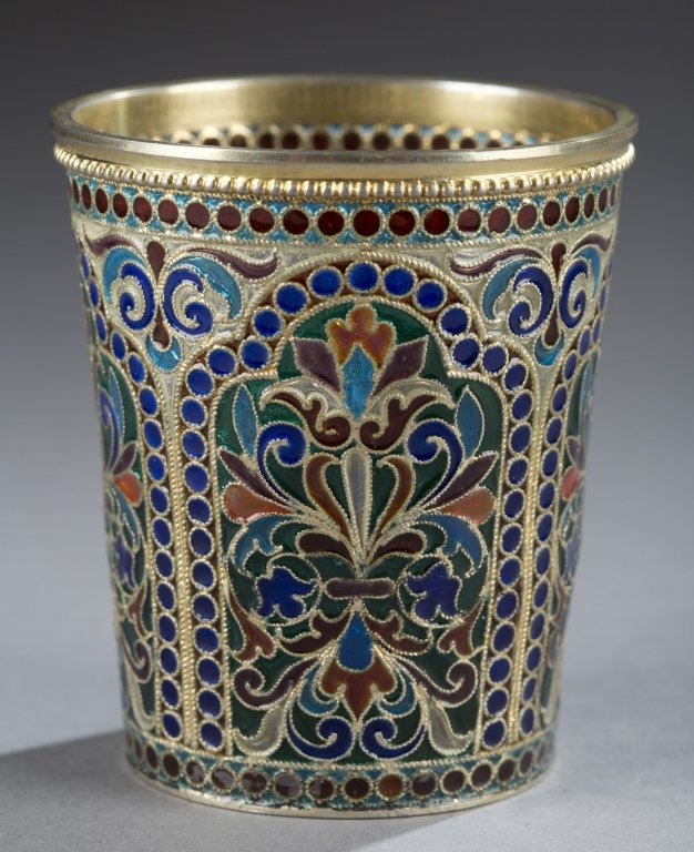 Russian plique-a-jour vodka cup.: A Russian silver gilt and plique-a-jour enameled vodka cup by Ivan P. Khlebnikov. C.1896. Decoration in floral motif. Stamped on bottom with 1896 with Royal Warrant mark, Assay-master's mark A.A. Mosc