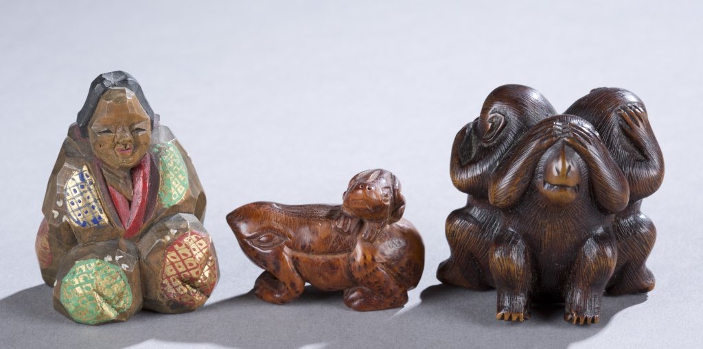 Group of 3 Netsuke: A group of 3 wood netsuke of humans and animals. ++ Woman sitting w/ painted kimono. 2". ++ See no evil, speak no evil, hear no evil. 1 1/2". ++ Toad w/ toad on its back. 1 1/2".