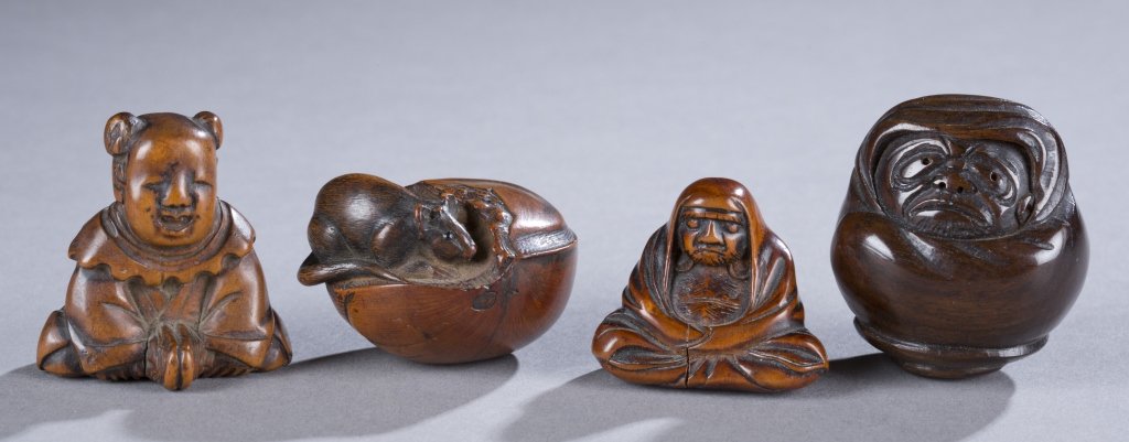A Group of 4 Netsuke: A group of 4 carved wood netsuke - Child, rat, Daruma . ++ A child sitting. 1 1/2". ++Rat on a nut. 1 1/2". ++ Man meditating. 1 1/4". ++ Daruma with a hooded cloak. 1 1/2".