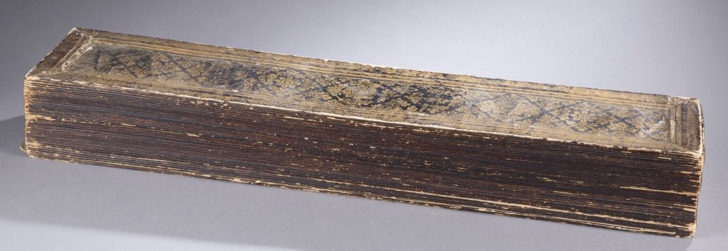 Buddhist prayer manuscript.: An antique folding Buddhist Sutra prayer book. Thai or possibly Tibetan. Having 93 pages of text and images measuring 23 3/16" x 5 3/8". The prayer book extends over 10 feet long when fully opened.