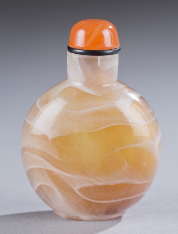 Brown and white glass snuff bottle.: A Chinese hand-blown glass imitating agate snuff bottle. 19th century. Round form with brown and white glass in a swirling design. 2 1/4". Ex of a Private Los Angeles collection.