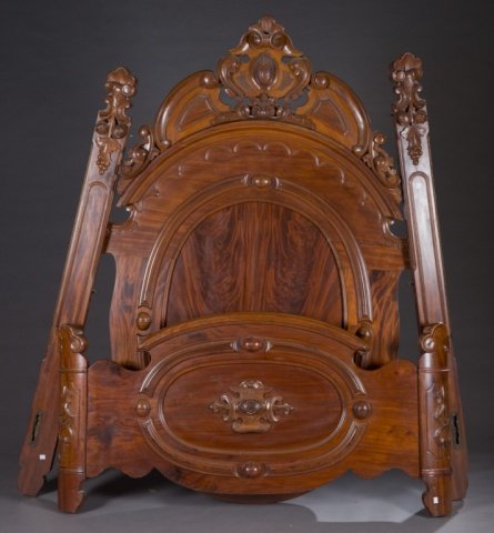 Flame mahogany plantation bed.: A Renaissance revival flame mahogany plantation bed. Second quarter 19th century. Having stylized serpentine posts with rounded carved tops, carved decoration of c-scrolls and grapes with leaves with 