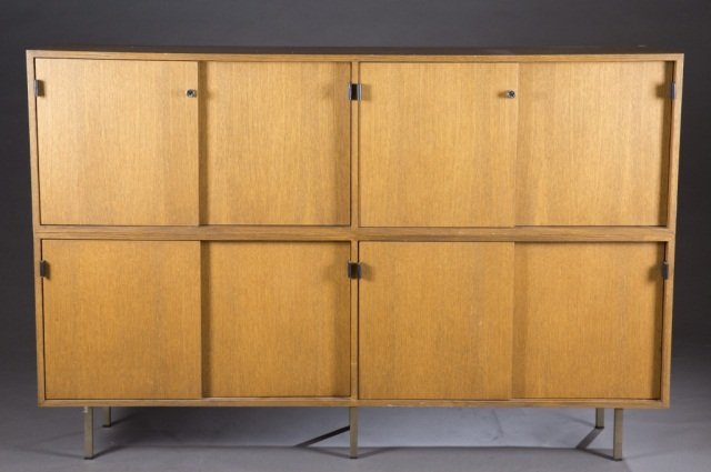 Knoll credenzas.: A pair of Knoll credenzas. 2nd half 20th century. Walnut with metal legs. Knoll sticker on bottom. 47"h x 71 1/4"w x 18"d. Condition: Some scratching and some corner wear.