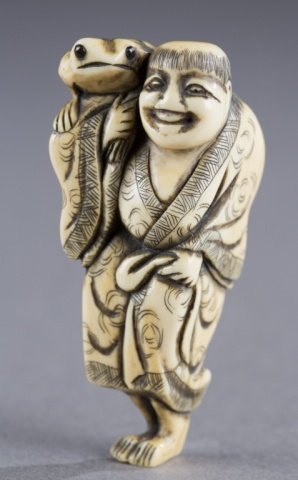 A Japanese ivory netsuke of gamma sennin with toad: A Japanese ivory netsuke of gamma sennin with toad. 18th century. Tonsured sennin with decorated robe with three-legged toad on his shoulder. Himotoshi on the back. 6.6cm h Provenance: The Humphrey co