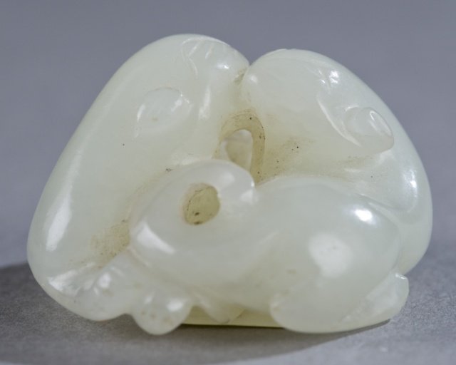 Japanese Jade netsuke of a pair of dragons.: A Japanese Jade netsuke of a pair of dragons. 19th century. Two dragons curled together forming a yin yang. 1 1/2"diam. Purchased by Leonard Weisman in Tokyo and Kamakura area from 1952-53, with colle