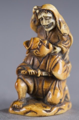 A Japanese ivory netsuke of woman on man’s back: A Japanese ivory netsuke of woman on man’s back(Folk tale). 18th century. Figure on top attacking figure on bottom and vice cersa. Himotoshi on bottom and lower back. Provenance: The Humphrey collec