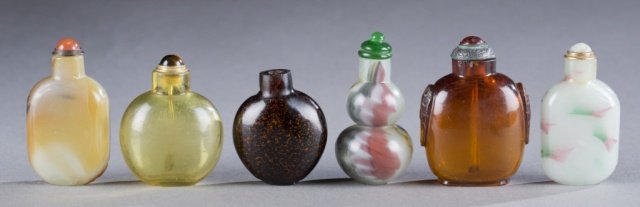 A group of 6 Chinese glass snuff bottles.: A group of 6 Chinese glass snuff bottles. 20th century. ++ Brown and white with black spots. Rounded rectangular form, with orange glass and metal stopper. 2 1/2".++ Clear yellow glass, flattened roun