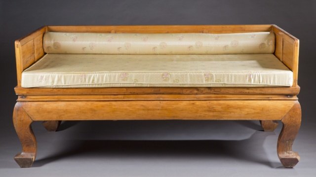 Chinese Opium bed.: A Chinese opium bed. 19th century. Light wood frame with woven cane mattress support on cabriole legs and squared feet. Mortise and tenon construction. 37" x 78 1/2" x 41". Condition: Slight cracking
