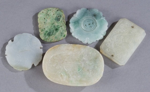 Ching Dynasty Jade & Hardstone plaques.: A group of 5 Ching Dynasty Jade & Hardstone plaques. ++Yin yang fish design. 2 1/8"diam. ++Bell design. 2" x 1 1/2". ++Round flower design.2 1/8"diam. ++Floral with person design.2 1/12" x 1 3/4" ++Fl