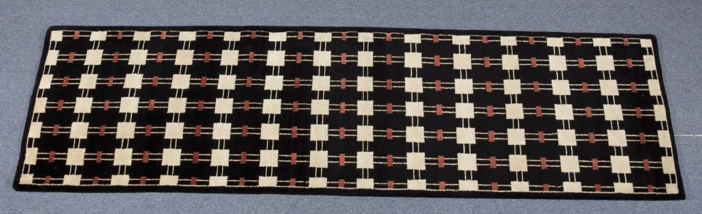 An Indo Nepalese Wool rug, 2'6" x 10'.: An Indo Nepalese Wool rug, 2'6" x 10'.