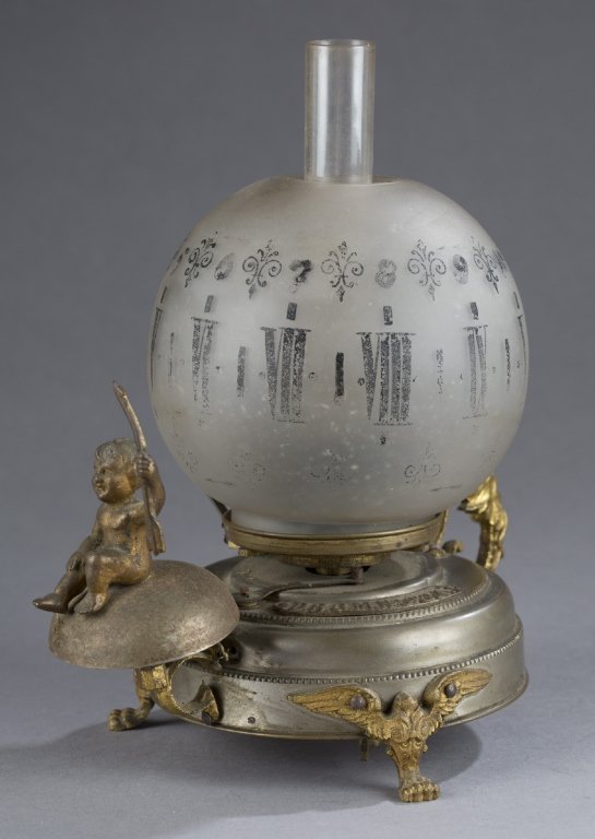 Victorian brass oil lamp clock.
