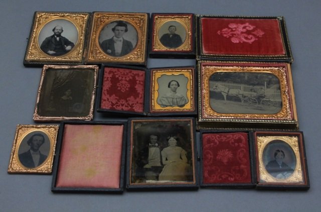 15 Ambrotypes incl. Horse & Carriage.: [Ambrotypes/Carriage/Portrait]. 15 Ambrotype portraits of men, women & children incl. image of man seated in horse-drawn carriage; quarter-plate size in black mother-of-pearl case w/ floral decoration