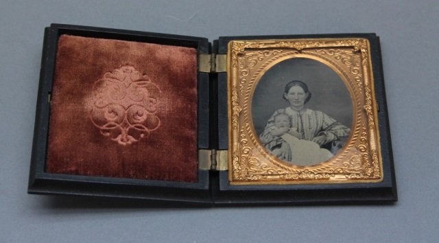 7 Daguerreotype or Union Cases.: [Daguerreotypes/Union Cases]. 7 Daguerreotype or Union Cases++Daguerreotype of seated man in "Cupid and the Wounded Stag" sixth plate case, by Littlefield, Parsons and Company [Krainik, p. 99]. Case a