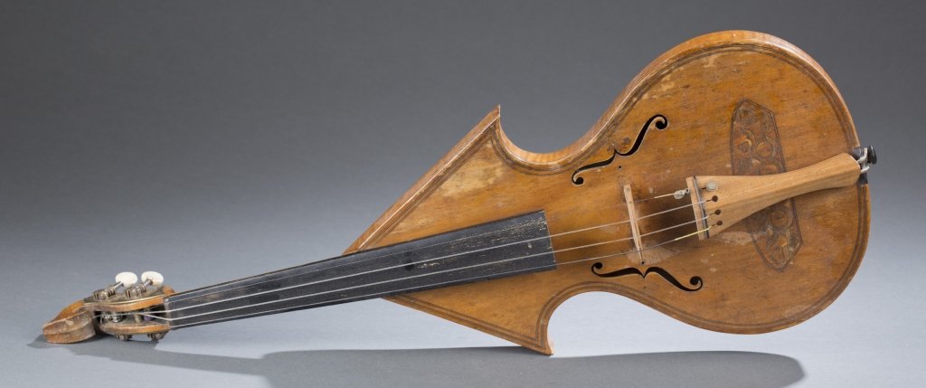 Philomela (Violin variant). c.1940-1960.: Philomela (Violin variant).c.1940-1960. Maker: Safran & Son. Philadelphia, PA. Bowed string instrument. This instrument has 4 strings; a shield-shape finial; machine head pegs tipped with bone; staine