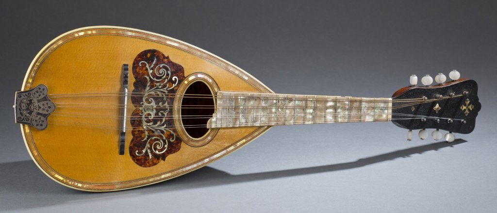 Bowl back mandolin. 20th century.: Bowl back mandolin. 20th century. Chicago, Illinois. Maker: Washburn. Signature: The Washburn. Bowed string instrument. This instrument has 4 double courses; abalone inlaid on fingerboard and decorate