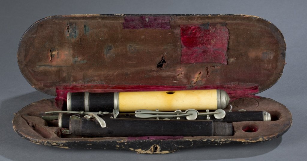 Flute. c.1880.: Flute. c.1880. Germany. Wood wind instrument. This flute has 11/13 keys of German silver in a simple system, post and pillars; an ebony body; a metal lined head joint sheathed in ivory; and Nicholson-