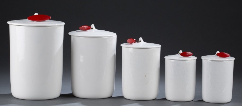 Group of 5 Schmid LaGardo Tackett Canisters.: A group of 5 Schmid LaGardo Tackett ironstone canisters. 1959-1960. Tackett. White ironstone with original red toggles. On bottom, maker's mark, NKT (3 pieces), SCHMID, OVENPROOF, IRONSTONE, TACKETT, 