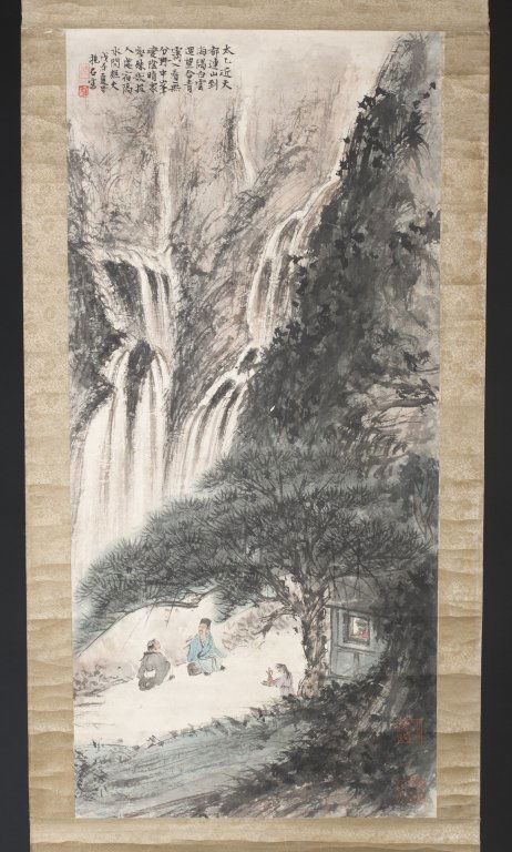 After Fu Baoshi Chinese painting of landscape.: A watercolor of figures in a landscape. 20th century. After Fu Baoshi. Two figures under a pine tree by waterfalls. Inscription with seal in u.r. On a scroll.