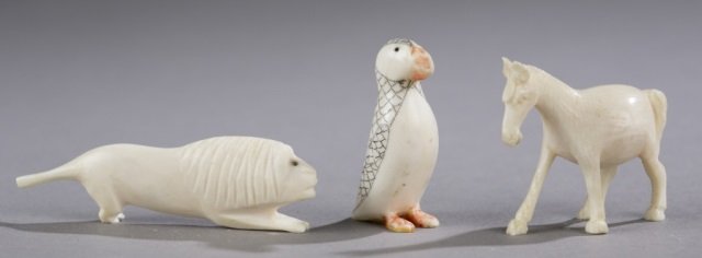 Group of netsukes.: Group of netsukes. Lion. 3/4" x 2 3/8".++ Puffin. 1 1/2" x 3/4". ++ Horse. 1 3/8" x 1 5/8".