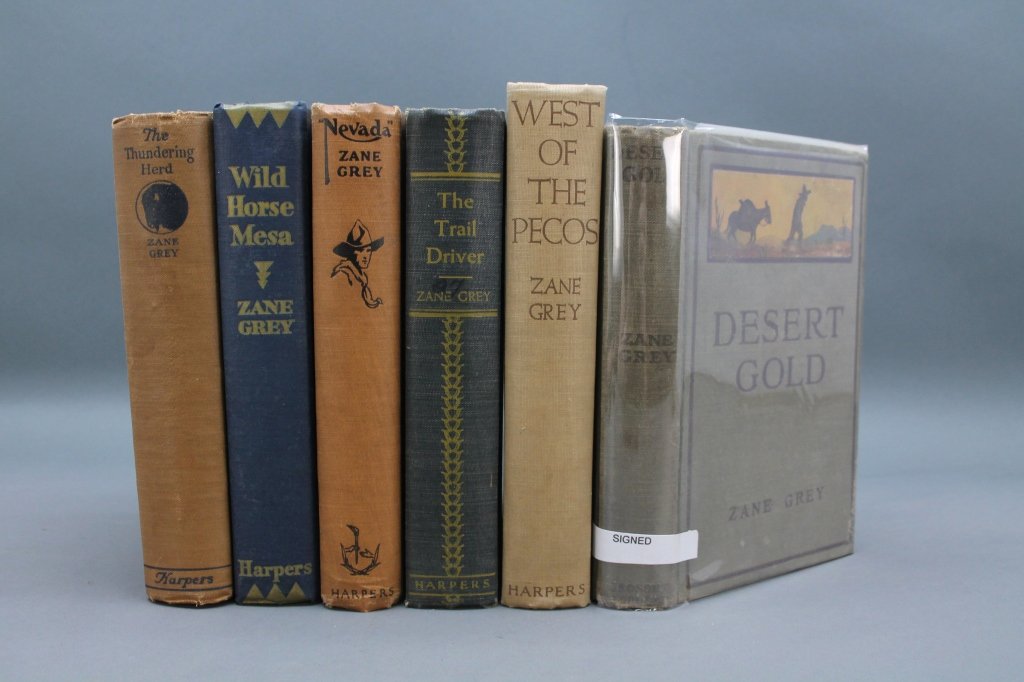Zane Grey: 1 signed + 5 first editions: [Grey, Zane]. 6 Titles: 1 signed, 5 First editions, each NY: Harper & Brothers. 8vo. Cloth. Fair. Lacking djs.++ DESERT GOLD. NY: Grosset & Dunlap, (1913). 8vo. Ffep signed and inscribed by Zane Grey 