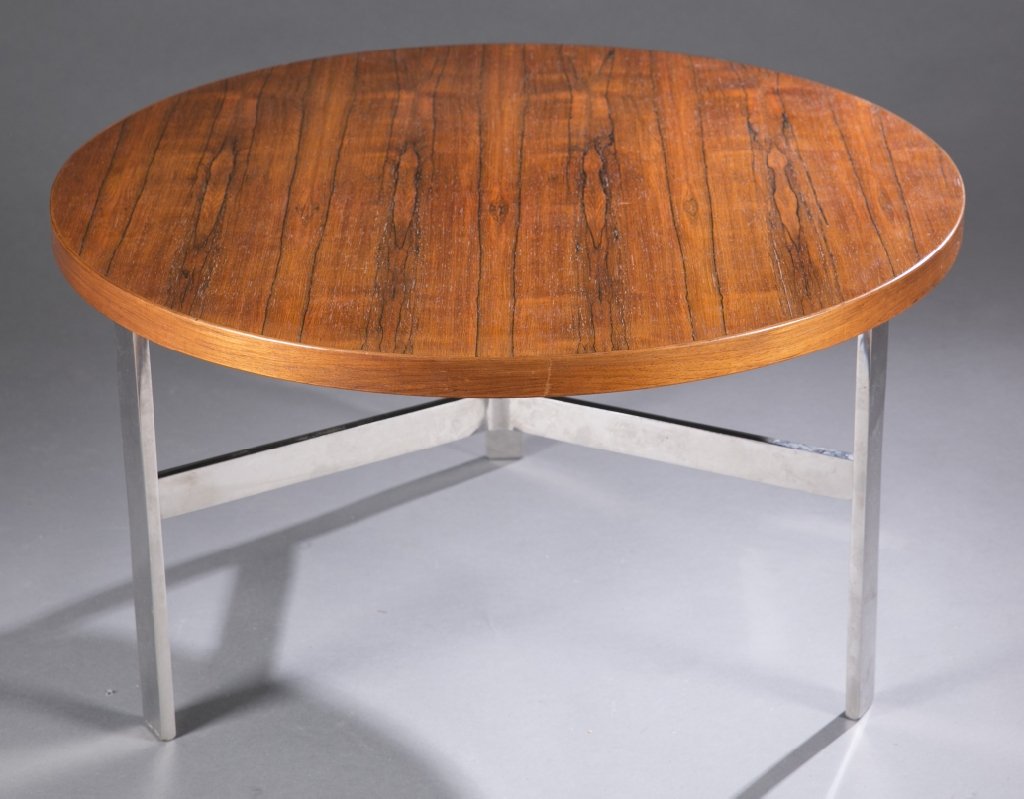 Rosewood Milo Baughman coffee table: Milo Baughman round coffee table. Rosewood with a chrome base.17"h X 30"diam.