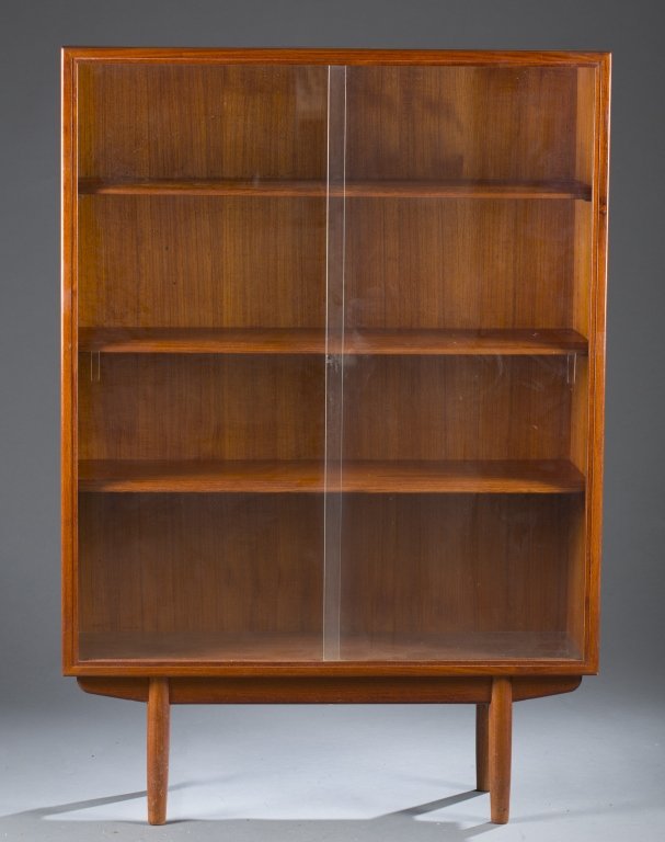 Hvidt and Molgaard-Nielson display cabinet.: A Peter Hvidt and Orla Molgaard-Nielson display cabinet. Mid 20th century. Teak with dovetail joinery and with adjustable shelves and glass doors. 57 1/4"h x 39 1/2'w x 12 1/4"d.